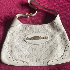 Preloved Authentic Vintage Gucci hobo Bag with gold hardware. Shows its flaws.